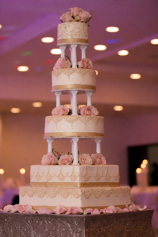 Blush Pillar Grand 5-Tier Wedding Cake ($9 per person)
